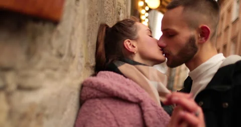 Close-up of the faces of a young couple in love kissing Stock Footage 247189583