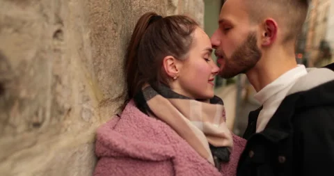 Close-up of the faces of a young couple in love kissing Stock Footage 247189879