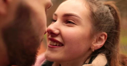 Close-up of the faces of a young couple in love kissing Stock Footage 247191182