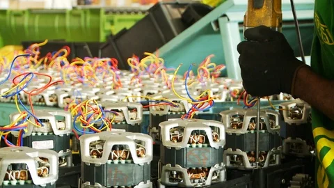 Close up of a factory worker using a power tool to quickly drill down Video stock 105916177