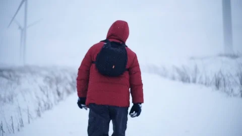 Close up fall snow man with backpack walk along in mountains winter lifestyle Stock Footage 105204769