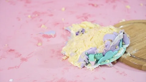 Close up of fallen colorful cake on messy pink floor Stock Footage 101118196