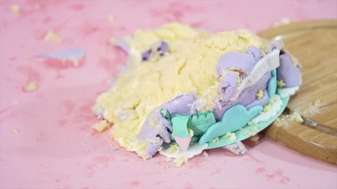 Close up of fallen colorful cake on messy pink floor Stock Footage 101118323