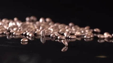 Close-up Falling Coffee Beans in Black Background Stock Footage 201284290