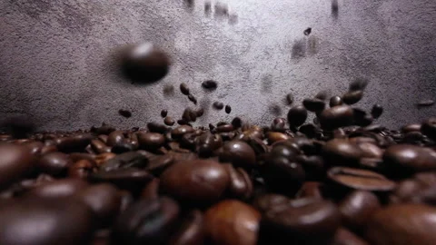 Close-Up of Falling Coffee Beans in Mesmerizing Detail Video stock 255327970