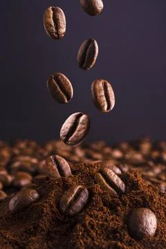 Close up of falling coffee beans Stock Photos
