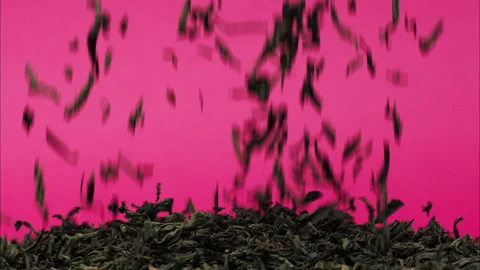 Close-up of falling down dried tea leave... | Stock Video | Pond5