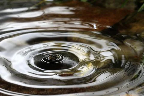 Close-up of a falling rain drop Stock Photos