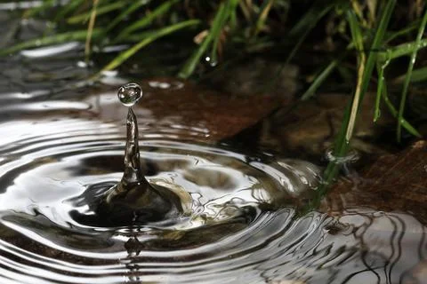 Close-up of a falling rain drop Stock Photos