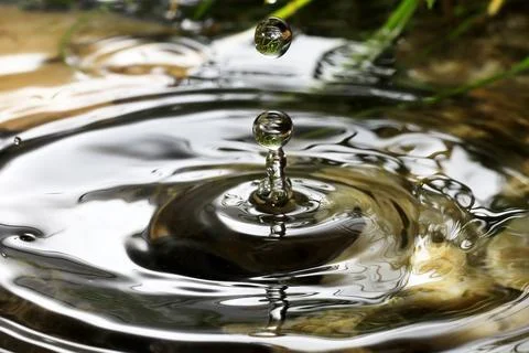 Close-up of a falling rain drop Stock Photos