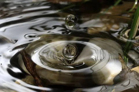 Close-up of a falling rain drop Stock Photos