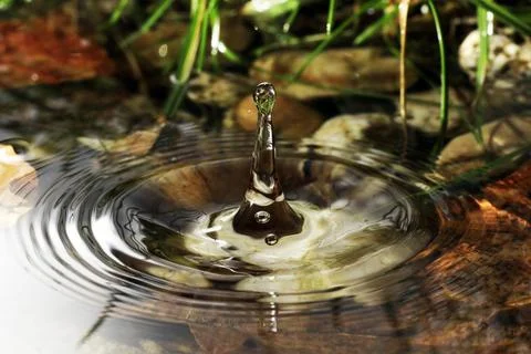 Close-up of a falling rain drop Stock Photos