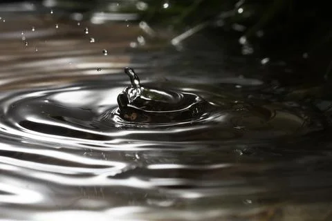 Close-up of a falling rain drop Stock Photos