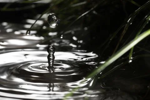 Close-up of a falling rain drop Stock Photos