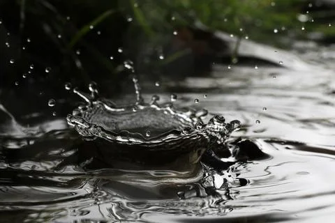 Close-up of a falling rain drop Stock Photos
