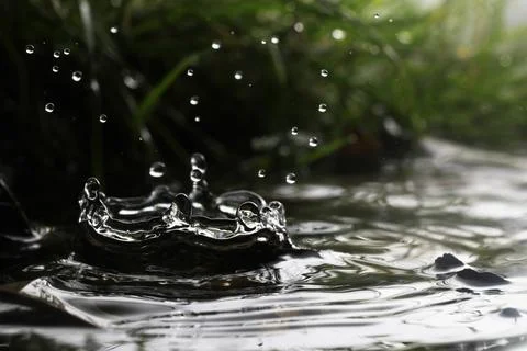 Close-up of a falling rain drop Stock Photos
