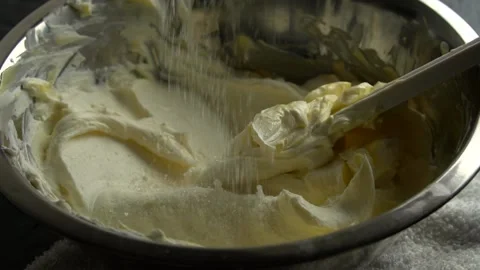 Close-up of falling sugar in cottage cheese,butter cream. Stock Footage 141131185