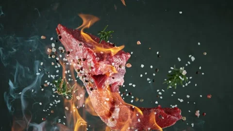 Close-up of falling tasty beef steak, slow motion. Stock Footage 139889326
