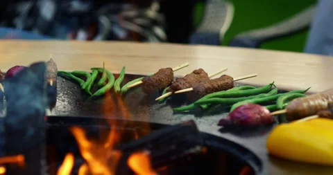 Close-up of falling tasty beef steak hamburg backyard Barbecue Stock-Footage 336576415