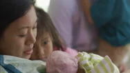 Close Up Of Family Admiring Newborn Baby Stock Footage
