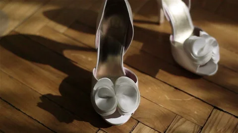 Close-up of fancy white shoes on high heels. 2 shots Stock Footage 49763531