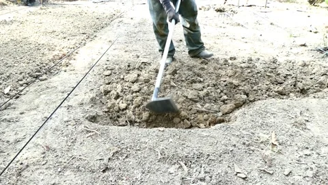 Close up farmer dig up the soil in garden Видео 150564188