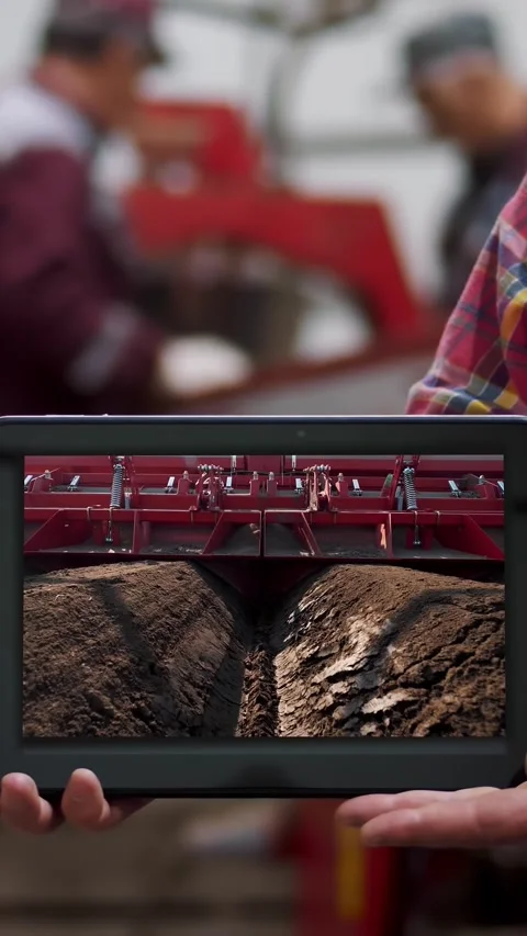 Close-up, farmer holds digital tablet in hands on background of potato storage Stock Footage 313990956