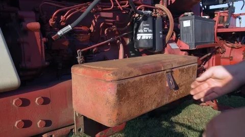 Close Up Of  Farmer's Hands Retrieving Tool from Rusty Toolbox in Slow Motion Stock Footage 124295947