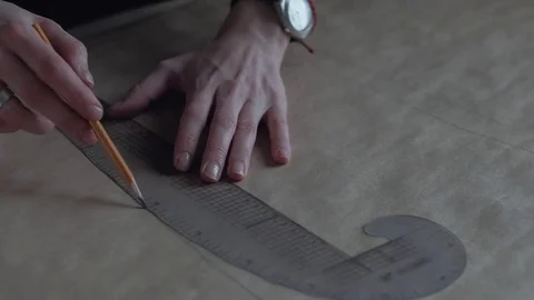Close-Up: Fashion Designer Creates the Layout of the Dresses Video stock 76347772