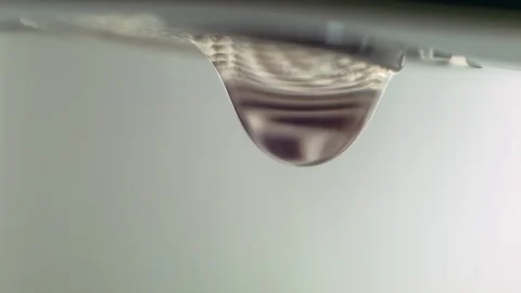 A close up of fast dripping tap. Drops of water. Stock Footage 129710429