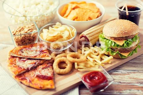 Close Up Of Fast Food Snacks And Drink On Table