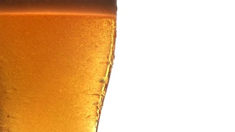 Close up of Fast Moving Beer Bubbles in Glass 動画素材 125482421