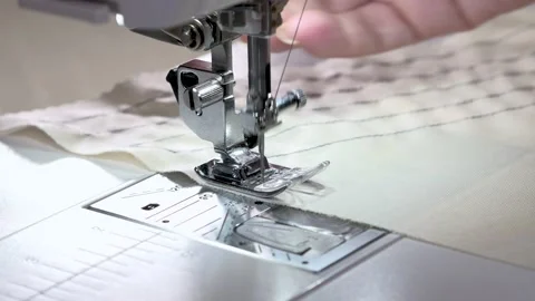 Close-up of fast-moving sewing machine needles Stock Footage 141747854