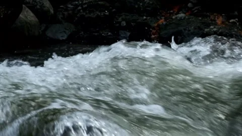 Close up of fast river flow and splashing water splashes Stock Footage 292933386