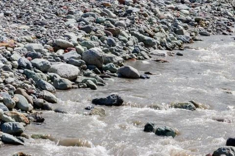 Close-up of a fast small mountain river Stock Photos