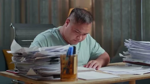 Close Up Of Fat Asian Man Working Hard With Documents At The Office Stock Footage 196113981