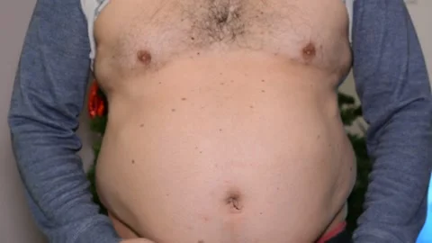 Close up fat man belly. overweight problems celebration of holidays Stock Footage 145124239