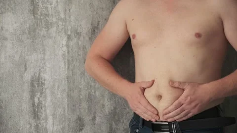 Close up fat man touch the Belly doing massage shaking. He very fat and has Stock Footage 141900642