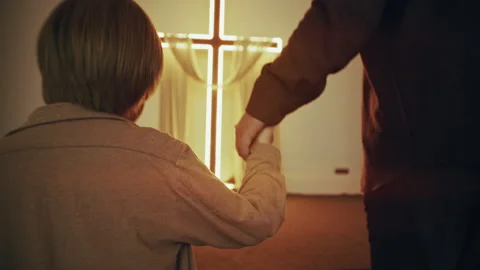 Close-Up: Father and Son Hands Walking to Glowing Cross Video stock 327208022