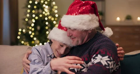Close-up of father and son hugging tightly. They greet each other with winter 動画素材 210605231