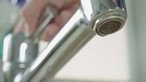 Close-up of a faucet being turned on Stock Footage 97072817