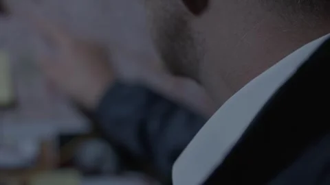 Close up of FBI agent looking at Paperwork on Evidence Board Stock Footage 312455285