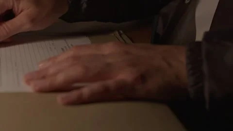 Close up of FBI agent reading documents Stock Footage 312455564