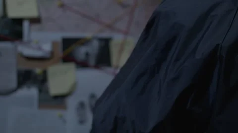 Close up of FBI agent reading Evidence Board Stock Footage 312455383