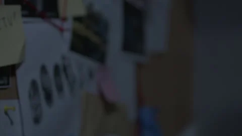 Close of FBI agents hand pointing at board Stock Footage 312455299