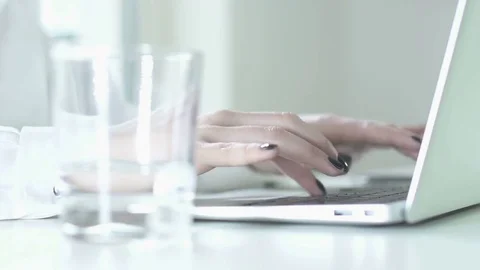 Close up of feamle worker tipping on computer keyboard in the office 動画素材 72871307