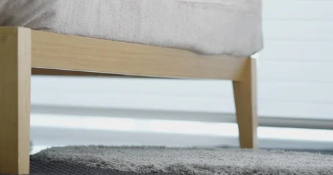 Close up on feet getting of from bed Stock Footage 100935033