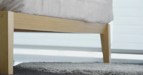 Close up on feet getting of from bed Stock Footage 100935194