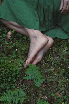 Close up feet on green forest ground concept photo Stock Photos