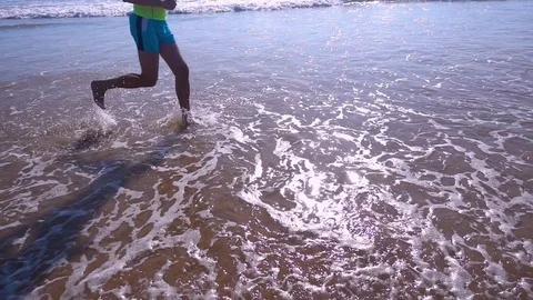 Close Up of Feet Running at the Beach Stock Footage 81791602